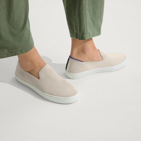hover | The Original Slip On Sneaker in Sand shown on a model.