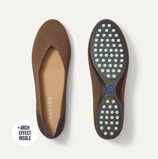 The Daily Flat in Minx shown from the top with one shoe showing the outsole.
