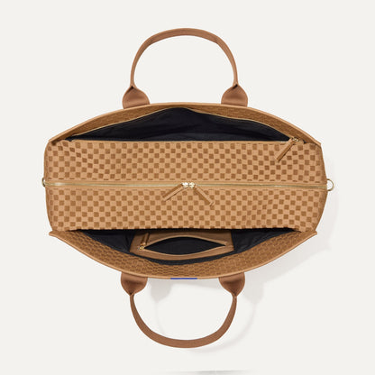 The Weekender in Hazelnut shown from the top with zipper side compartment and magnetic side compartment open.