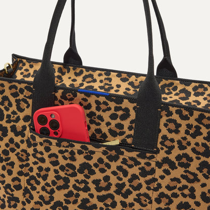 A closeup of The Classic Tote in Toasty Cat, focusing on the exterior zip pocket.