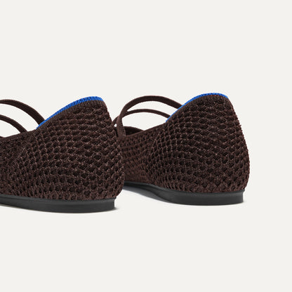 Close up of the heel of The Double Buckle Mary Jane in Chocolate Mesh, with Rothy's signature blue halo.