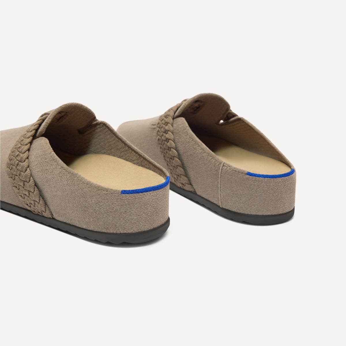 Close up of the heel of The Braid Clog in ReVelvet Sparrow, with Rothy's signature blue halo.