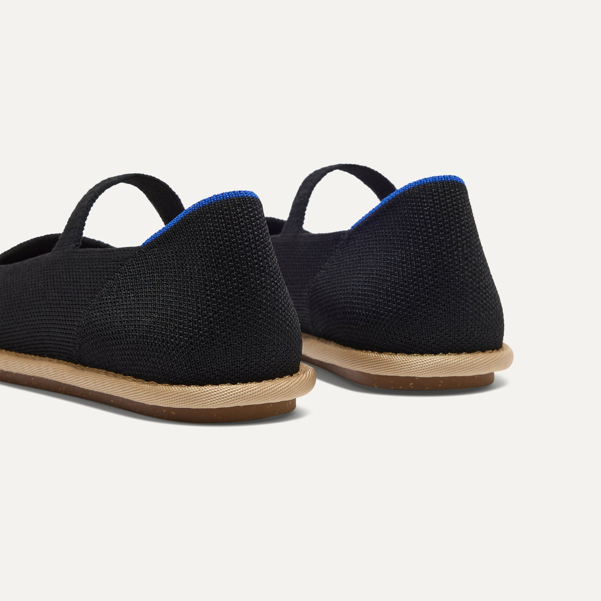 Close up of the heel of The Cruiser Mary Jane in Black, with Rothy's signature blue halo.