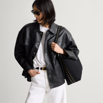 hover | The Bucket Bag in ReVelvet™ Black shown worn differently on model.