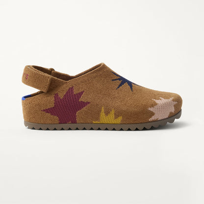 The Kids Clog in ReVelvet™ Butterscotch Burst shown from a side view showing the outsole.