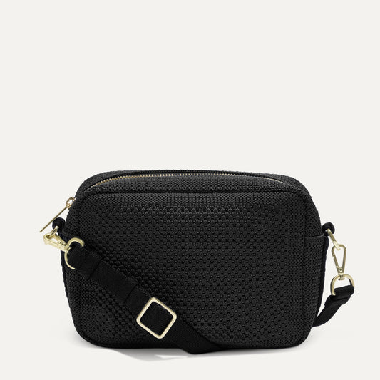 PDP |The Crossbody Camera Bag in Black Licorice Open-Knit, shown from the front.