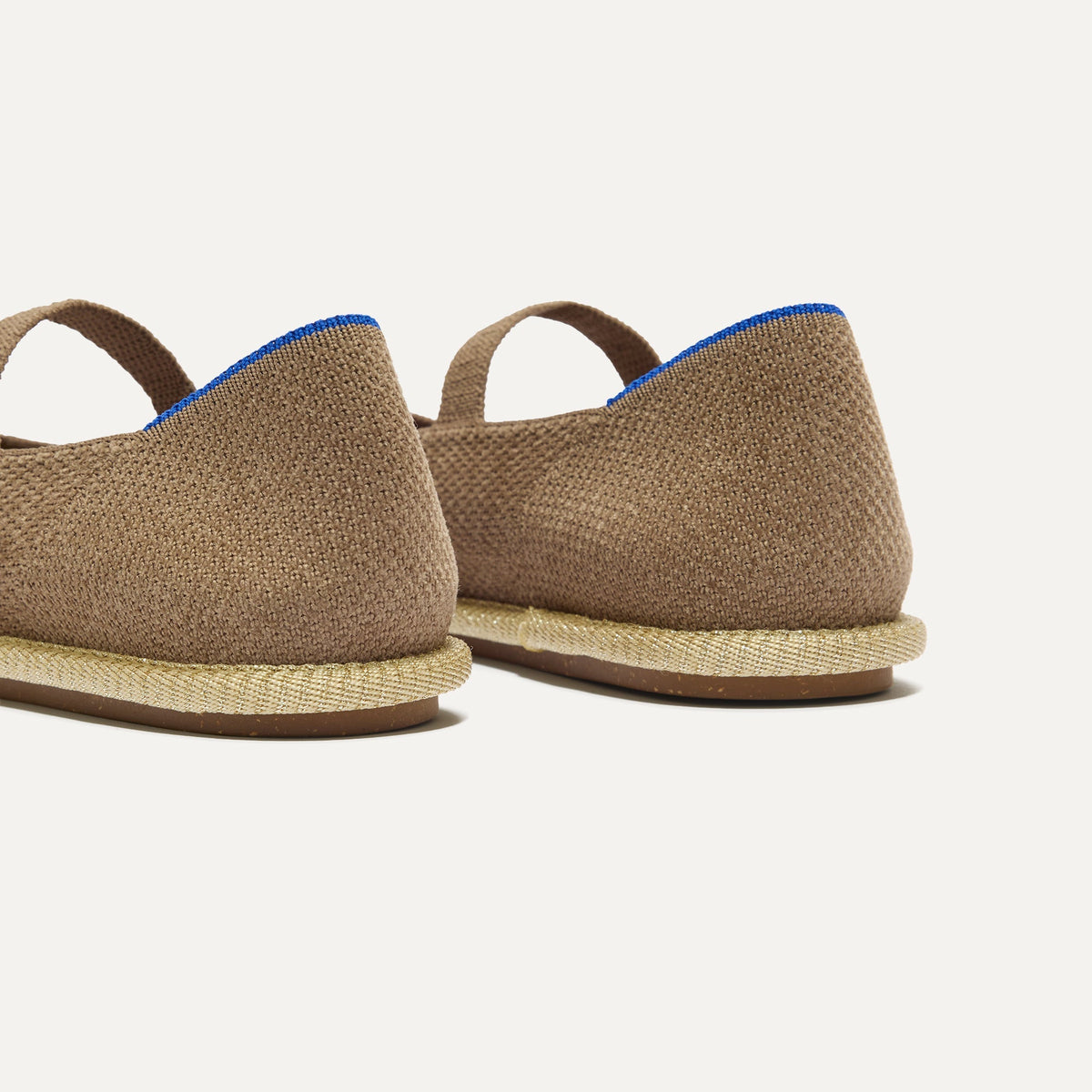 Close up of the heel of The Cruiser Mary Jane in ReVelvet™ Portobello, with Rothy's signature blue halo.