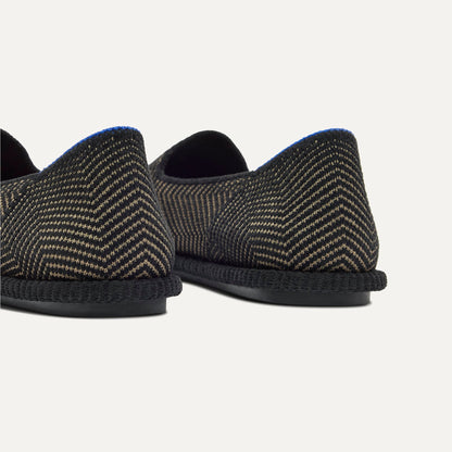 Close up of the heel of The Cruiser Loafer in ReVelvet Jet Herringbone, with Rothy's signature blue halo.