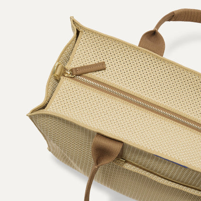 The Classic Tote in Macadamia Open-Knit, shown from above, with the top zipper closed.