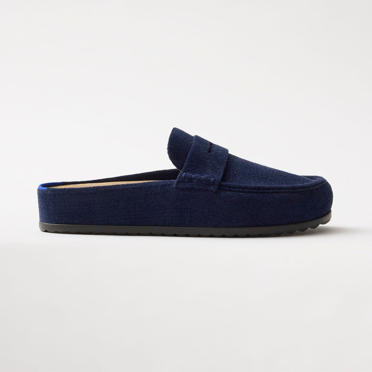 side | The Penny Clog in ReVelvet™ Navy shown from the side.